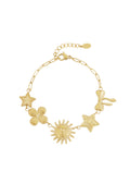 Statement schakelarmband met figuurtjes van een ster, een bloem, een zon, en een strik goud