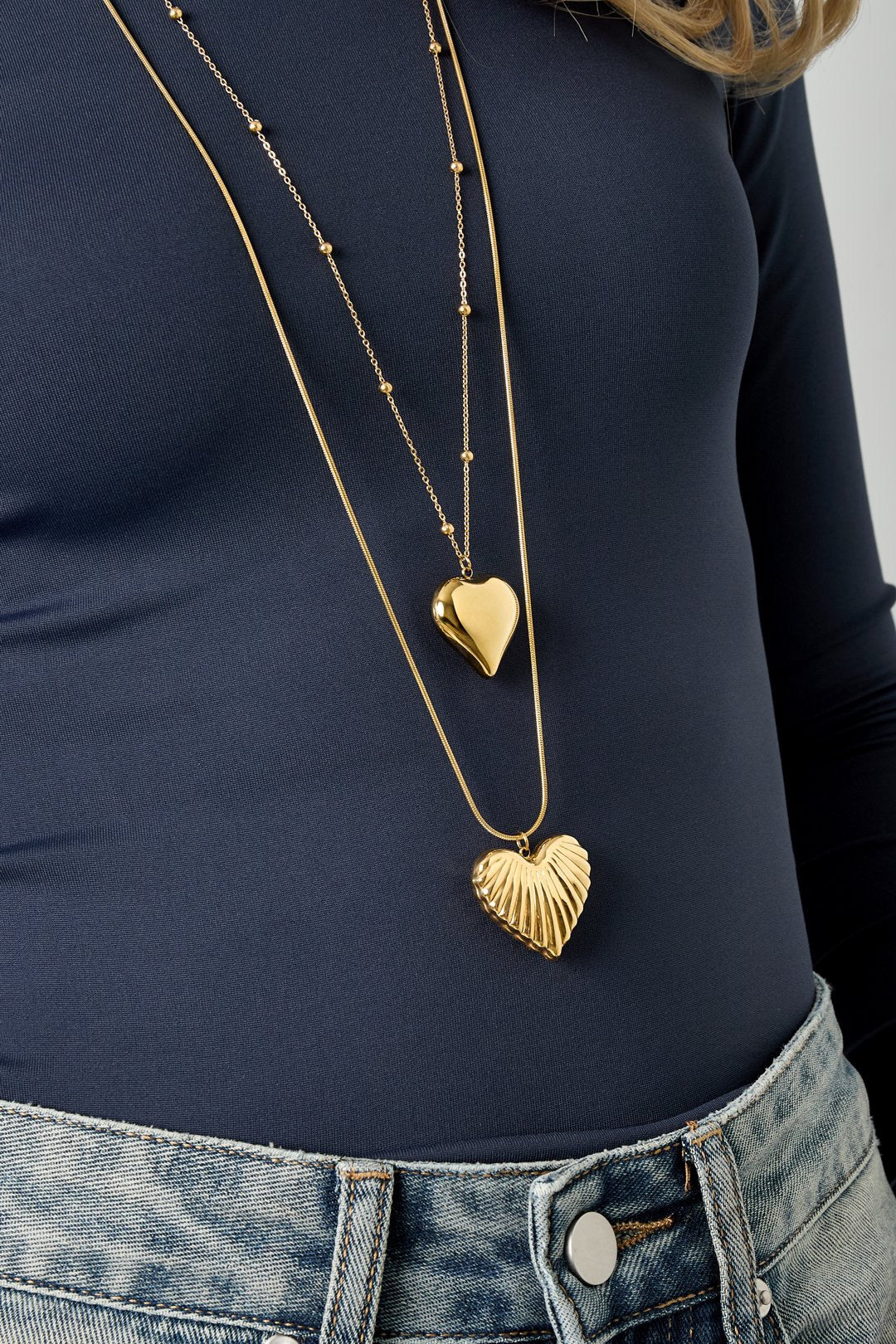 Lange hartjes ketting in het goud