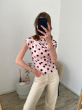 Top met stippen in het roze met zwart