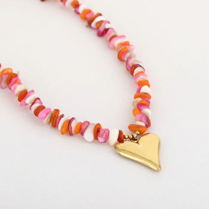 Kralen ketting met hartjes hanger oranje in het goud