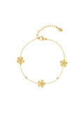 Armband met bloemetjes en glitters in het goud